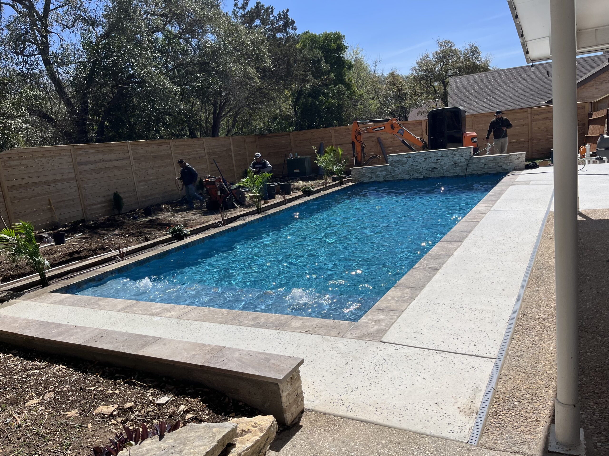 Custom swimming pool and concrete pool deck in San Antonio, TX